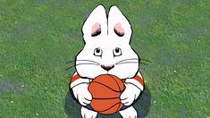 a white rabbit holding a basketball in its paws