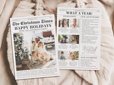 two newspaper articles laying on top of a bed next to a stuffed animal and christmas tree