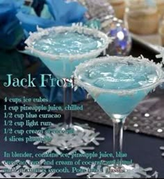 an image of two blue cocktails on a table