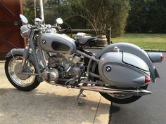 a silver motorcycle parked on top of a parking lot