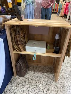 an open shelf with items on it in a store