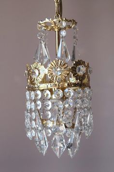 a gold chandelier hanging from a ceiling