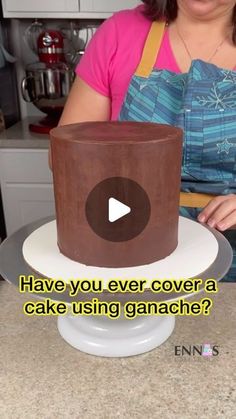 a woman is making a chocolate cake with the words have you ever cover a cake using ganache?