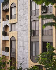 an apartment building with balconies and windows