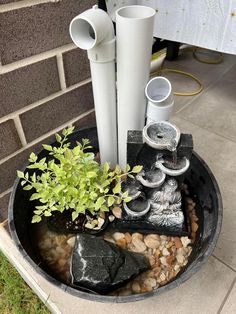 a potted planter filled with rocks and plants