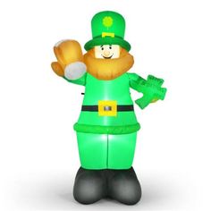 AreyoustilllookingforauniquedecorationforStPatrick'sDayThisinflatableleprechaunisyouridealchoicethatcanbeusedinthelawn,backyardandfrontdoor.Theperfectcombinationofshamrockandpotofgoldmakesyouimmersedinafestivalatmosphere.Besides,theglowingLEDlightswilleasilyappealtoyourkids,guestsandneighbors,thusgettingalotofcomplimentsfrompeoplearound.Waterproofpolyesterfabricensureslong-termuseandnecessaryaccessoriesalsogreatlyenhancetheoverallstabilityoftheinflat Giant Doll, Festival Atmosphere, Holiday Inflatables, Inflatable Decorations, Yard Lights, Giant Inflatable, Christmas Inflatables, Unique Decoration, Pot Of Gold