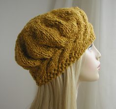 a mannequin head wearing a yellow knitted hat