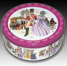 a pink and white tin with an image of a man on it's lid