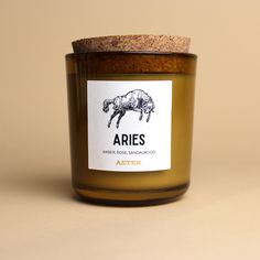 an image of a jar of candles with the label aries on it