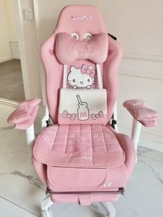 a pink hello kitty high back office chair with matching foot rest and headrests