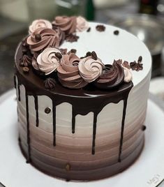 a cake with chocolate icing and flowers on top