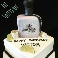 a birthday cake with a bottle and lime on top that says, happy birthday victoria