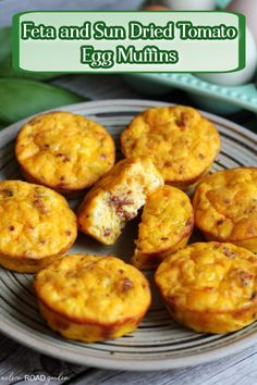 some muffins are on a plate with the words feta and sun dried tomato egg muffins