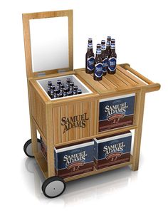 a wooden cooler with six beer bottles in it and a mirror on the top shelf