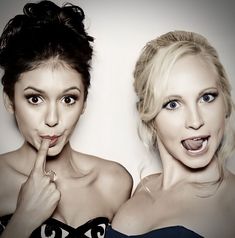 two women making funny faces with their fingers