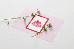 a pink card with some flowers on it