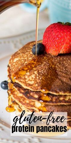 a plate topped with pancakes covered in syrup