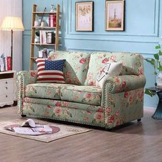 a living room scene with focus on the couch and chair, which is decorated in blue