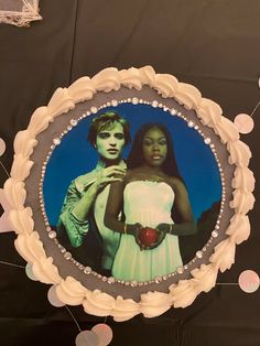 a cake decorated with an image of two people