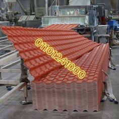 an industrial factory with several rows of red roof tiles