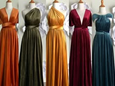 four dresses on mannequins in different colors