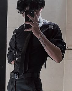 a man taking a selfie in front of a mirror