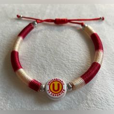 White & Red Threaded Bracelet With U Letter Charm U ( Soccer Sport Club ) Letter Charm Bracelet Unisex ( Men & Women ) Bracelet. Adjustable Bracelet. Peruvian Soccer Sport Club Made In Peru. Threaded Bracelet, U Letter, Letter Charm Bracelet, Sport Club, Thread Bracelets, Letter Charm, Women Bracelet, Mens Accessories Jewelry