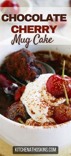 chocolate cherry mug cake in a white bowl with whipped cream and cherries on top