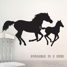 two black horses running in opposite directions on a white wall with the words available in sizes