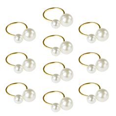 six pairs of white pearls on gold plated ear wires, each with a single pearl in the middle