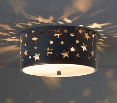 a ceiling light that has stars on it