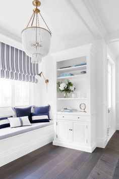 a white room with blue and white decor