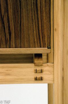 a close up view of a wooden drawer