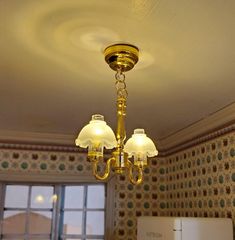 a chandelier hanging from the ceiling in a kitchen