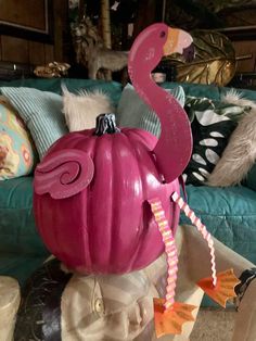 a pink pumpkin shaped like a flamingo