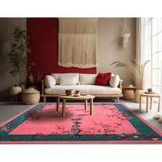 a living room with red walls and rugs on the floor in front of it