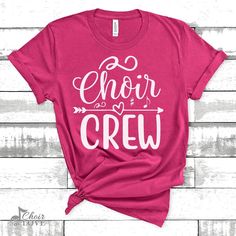 a pink t - shirt that says crazy choir lady on the front and black lettering