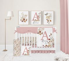 a baby's room with pink and white decor, including a crib bedding set