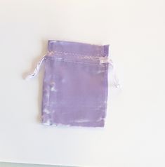 a small purple bag sitting on top of a table