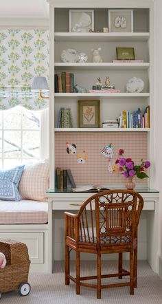 a room with a chair, desk and bookshelf