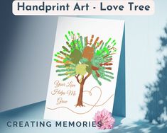 a handprint art - love tree is displayed on a card with flowers and leaves