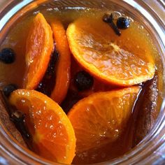 orange slices and raisins are in a jar