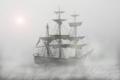 an old sailing ship in the foggy water