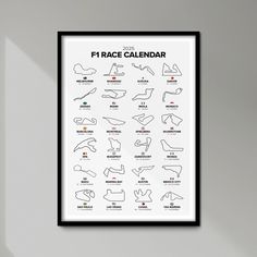 a framed poster with the names and numbers of different race cars on it's side