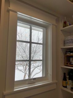 the window is open to let in some fresh snow on the outside and inside it