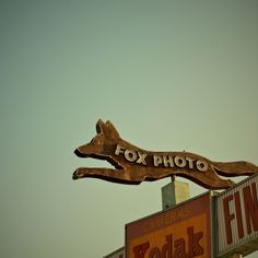 a fox photo sign on top of a building