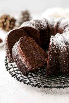 a chocolate bundt cake sitting on top of a cooling rack