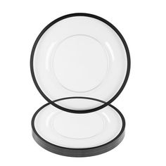 two black and white plates sitting on top of each other