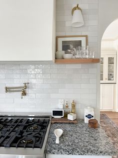 a stove top oven sitting inside of a kitchen