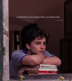 a young man leaning his head on top of a stack of books with the caption i waited for you longer than you deserved